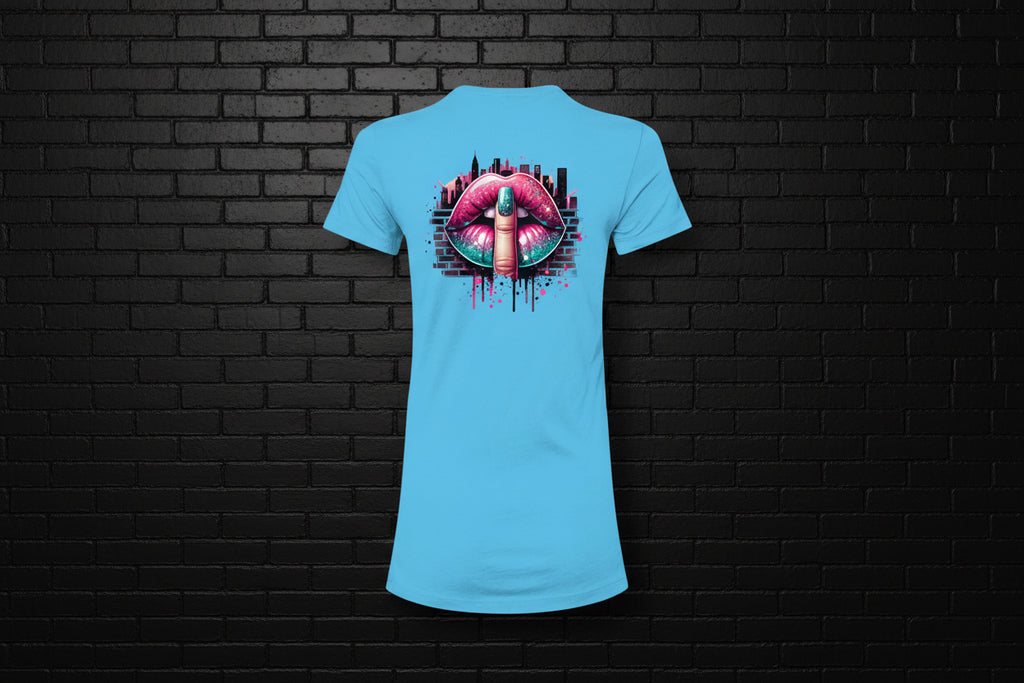 Turquoise women's slim fit graphic tee with a shushing lips city design against a black brick wall background.