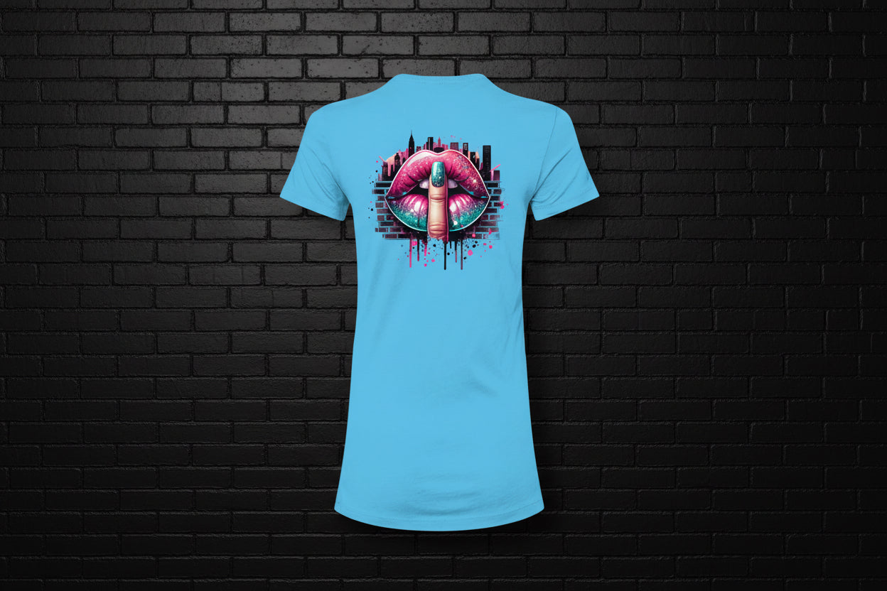Turquoise women's slim fit graphic tee with a shushing lips city design against a black brick wall background.