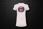 Back view of a white women’s slim fit cotton tee featuring a vibrant shushing lips graphic against a black brick wall.