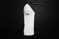 Side view of white No Talking women's slim fit graphic tee in premium cotton against a black brick wall background.