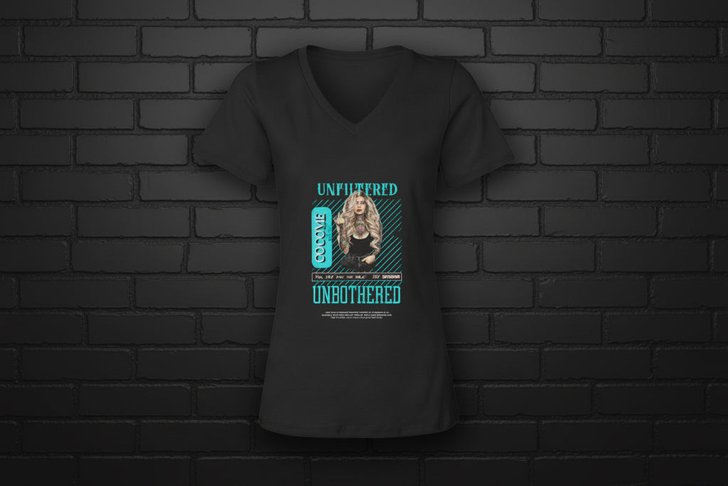Black V-neck graphic tee featuring Unfiltered Unbothered design with turquoise accents on a dark brick wall background.