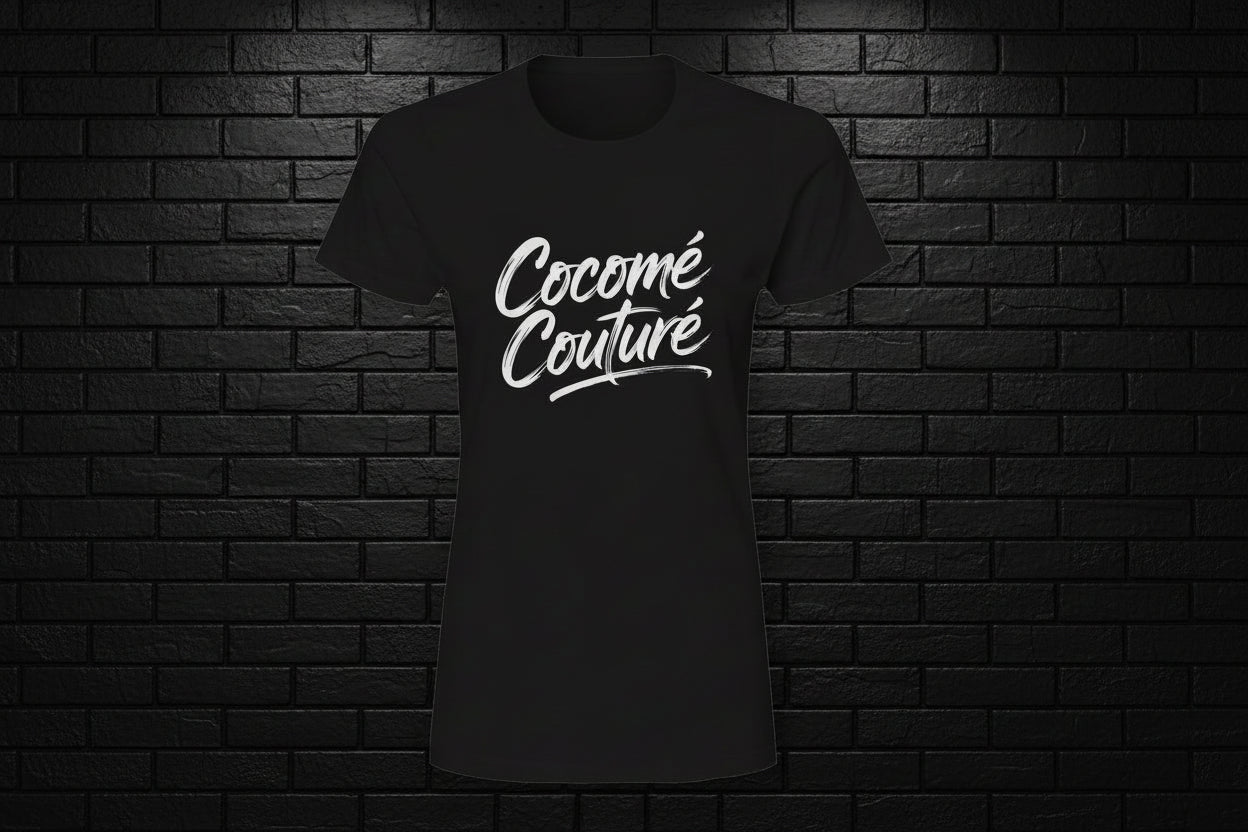 Black Unique Look premium 100% cotton tee with white Cocome Couture script logo on a dark brick background.