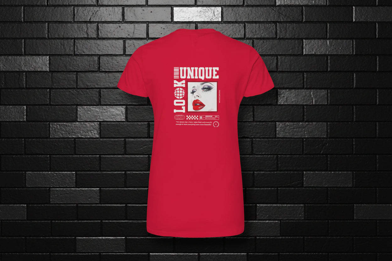 Back view of a red premium cotton tee with 'Unique Look' graphic against a black brick wall background.