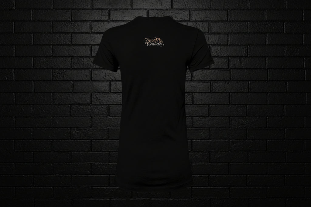 Back view of the Breathe Luxury Slim Fit Tee in black featuring a white Cocome Couture logo against a black brick wall.