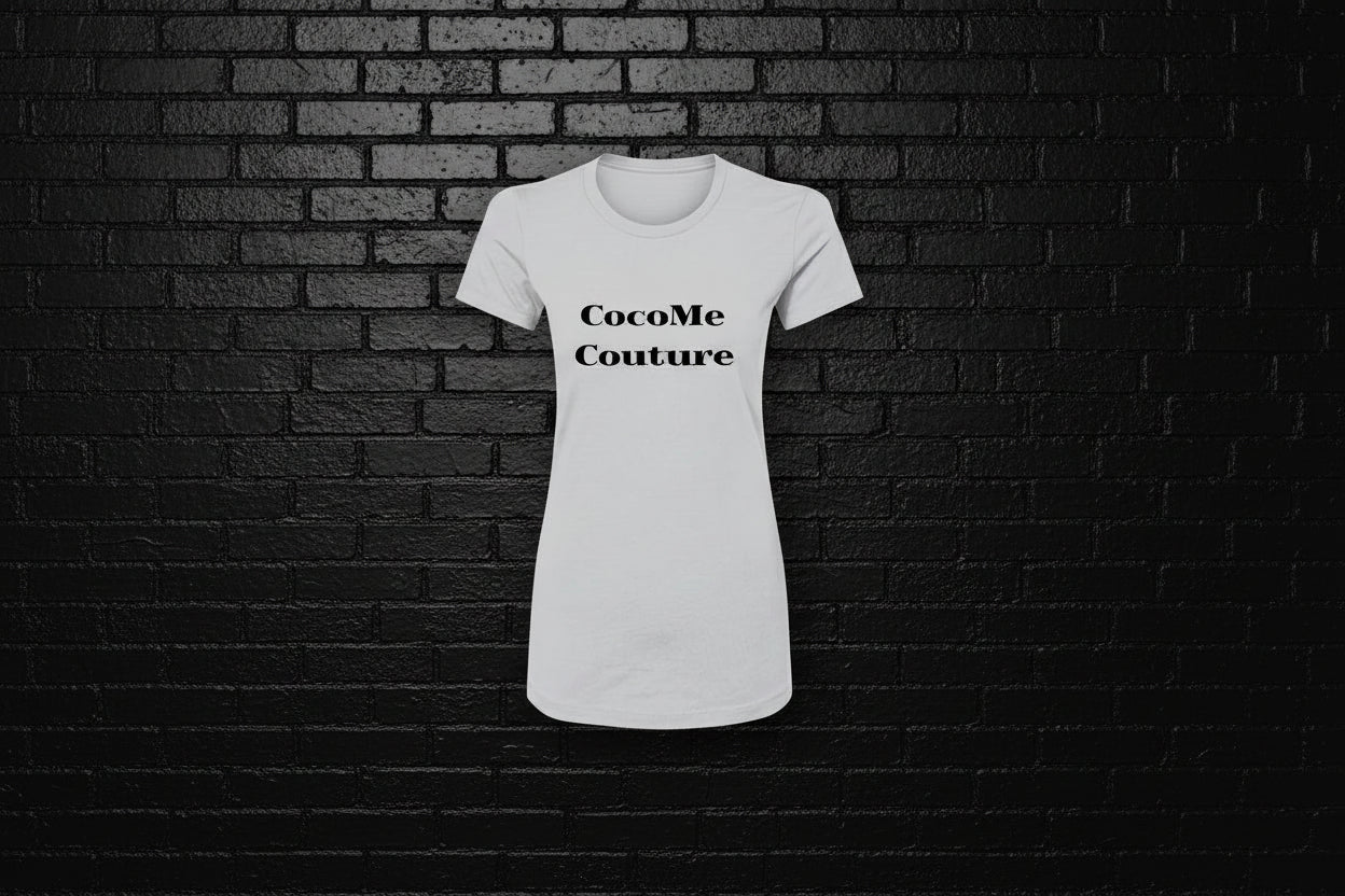 White Royal Rebellion graphic tee with CocoMe Couture text displayed against a black brick wall background.