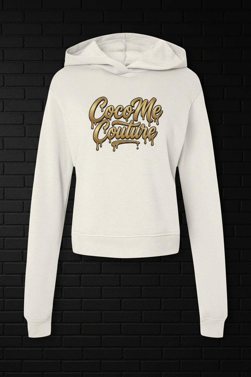 Kiss My Couture cream hoodie with gold dripping CocoMe Couture logo. Luxe streetwear fleece in a premium silhouette.