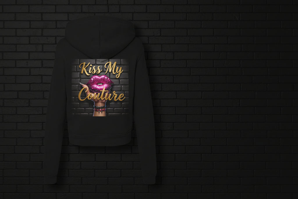 Back view of a black Kiss My Couture luxe streetwear hoodie featuring a pink lips graphic and gold script lettering.