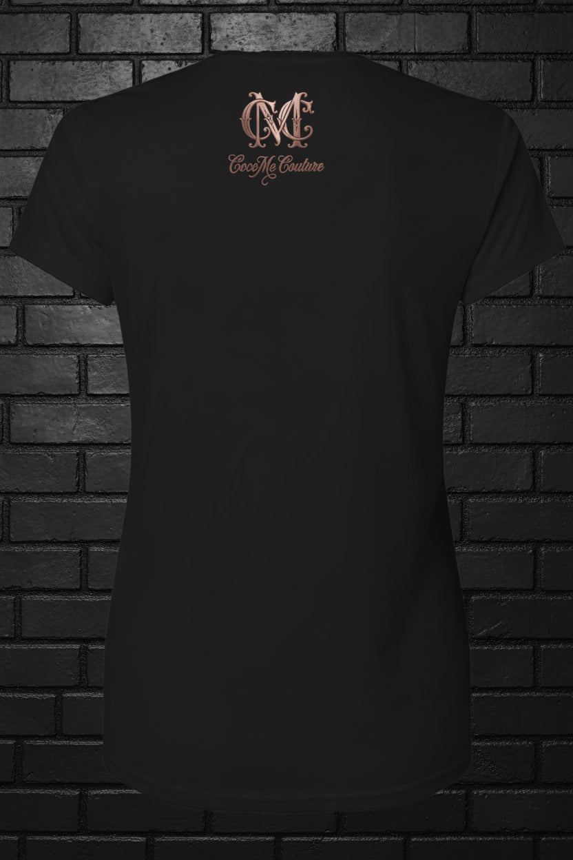 Back view of black Soft but Dangerous Performance Tee featuring rose gold Cocome Couture logo on a brick background.
