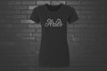 Black heavyweight Aries zodiac shirt with cursive silver text, modern classic fit on a black brick background.