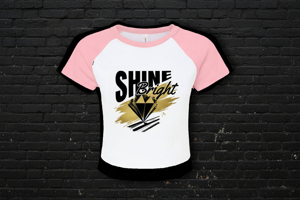 Women's 90s style Y2K raglan baby tee in pink and white micro rib with Shine Bright diamond graphic.