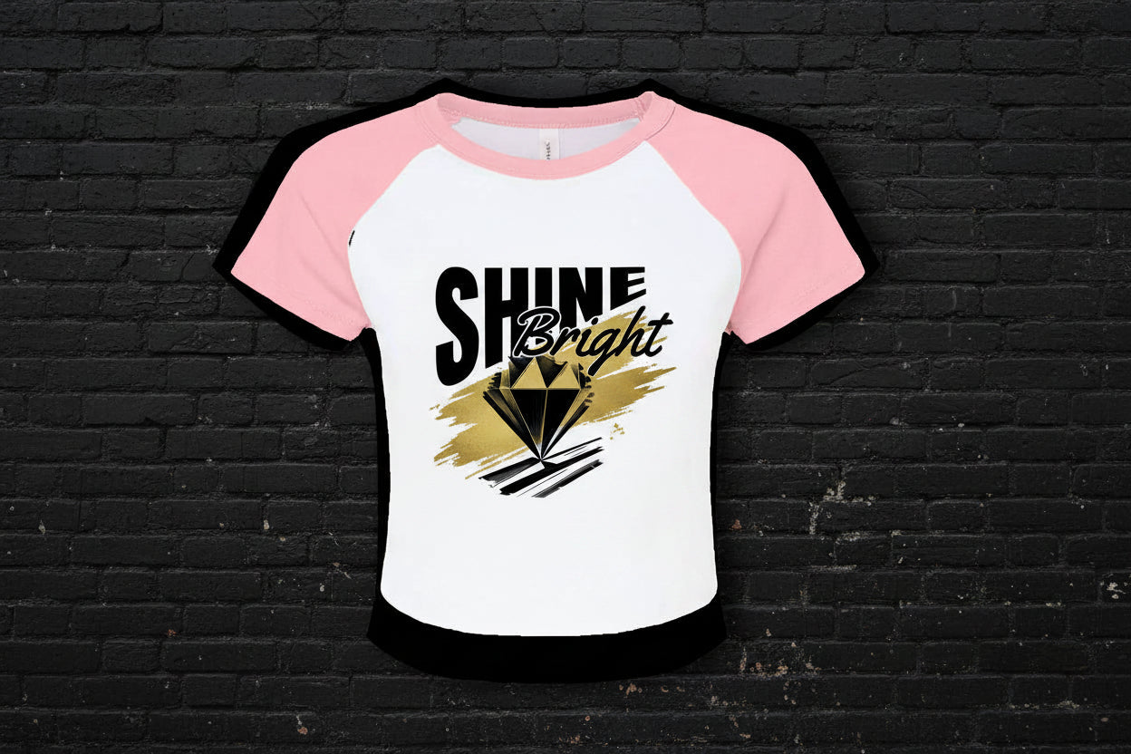 Women's 90s style Y2K raglan baby tee in pink and white micro rib with Shine Bright diamond graphic.