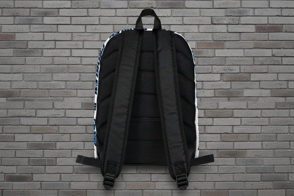 Rear view of Pretty But A Problem laptop backpack showing ergonomic padded straps and mesh back against a brick wall.