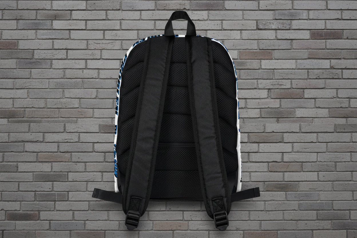 Rear view of Pretty But A Problem laptop backpack showing ergonomic padded straps and mesh back against a brick wall.
