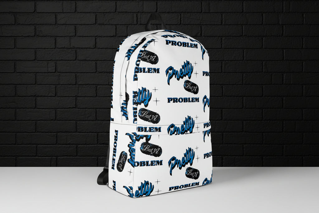 White water-resistant 15-inch laptop backpack with blue and black graphic print against a dark brick wall.