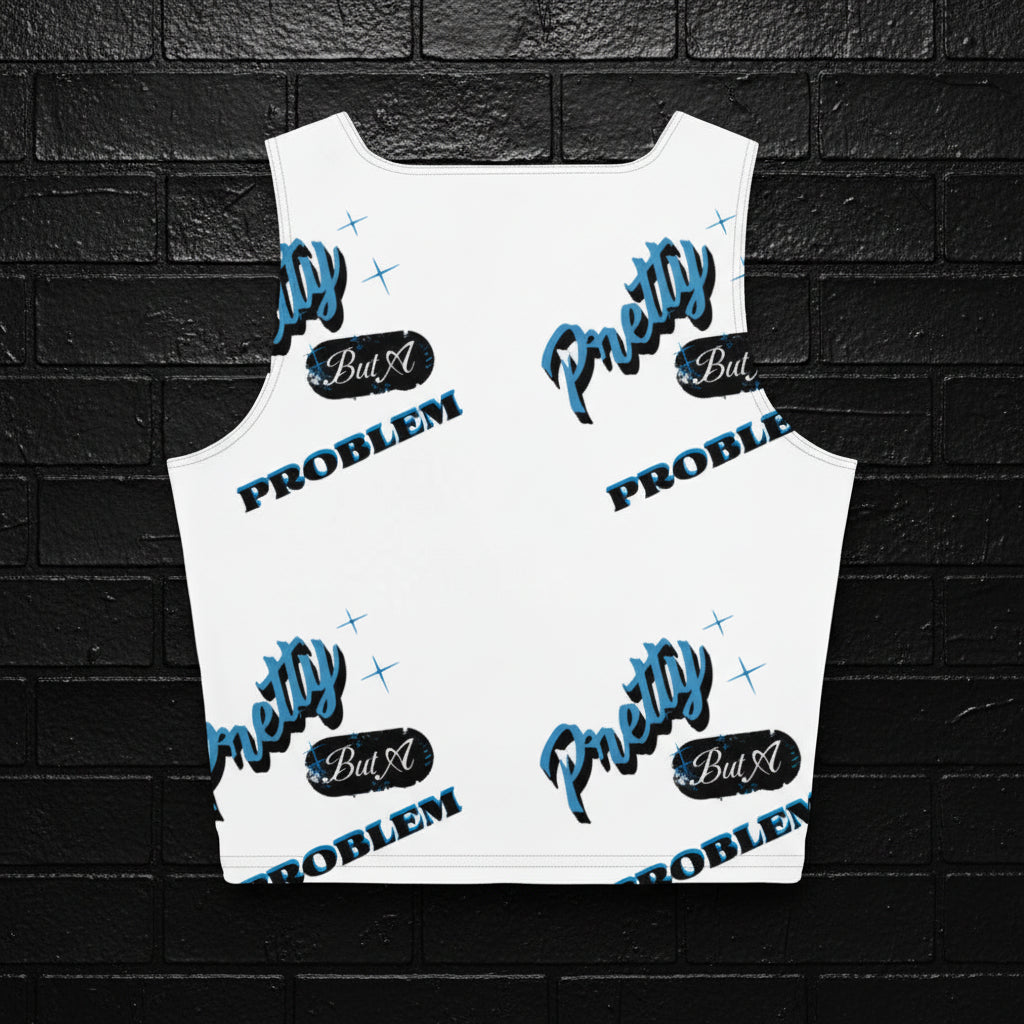 White Women's Graphic Crop Top with Pretty But A Problem blue all-over print on a black brick wall background.