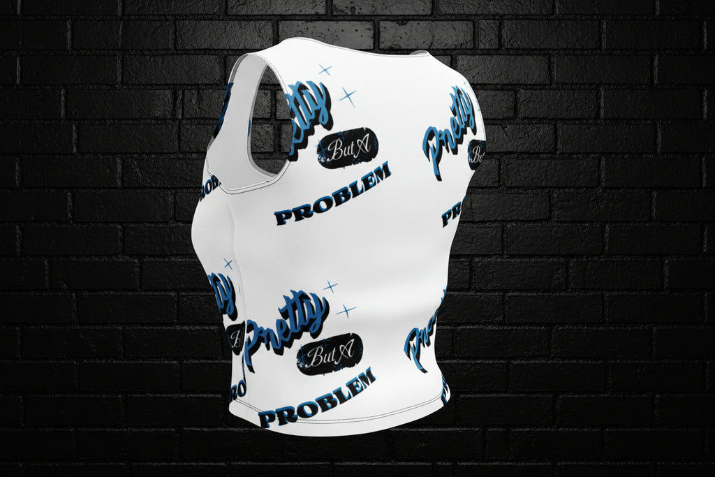 Back view of a white women's graphic crop top with blue and black text against a dark brick wall.