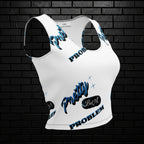 Angled side view of Pretty But A Problem white women's graphic crop top with blue text on a black brick background.