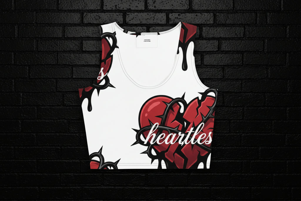 Women's streetwear Heartless Crop Top featuring a red broken heart and thorns graphic on white fabric.