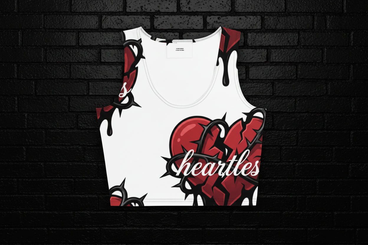 Women's streetwear Heartless Crop Top featuring a red broken heart and thorns graphic on white fabric.