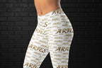 Side view of high waisted white yoga leggings with a golden Aries all-over print on a body-contouring fit.