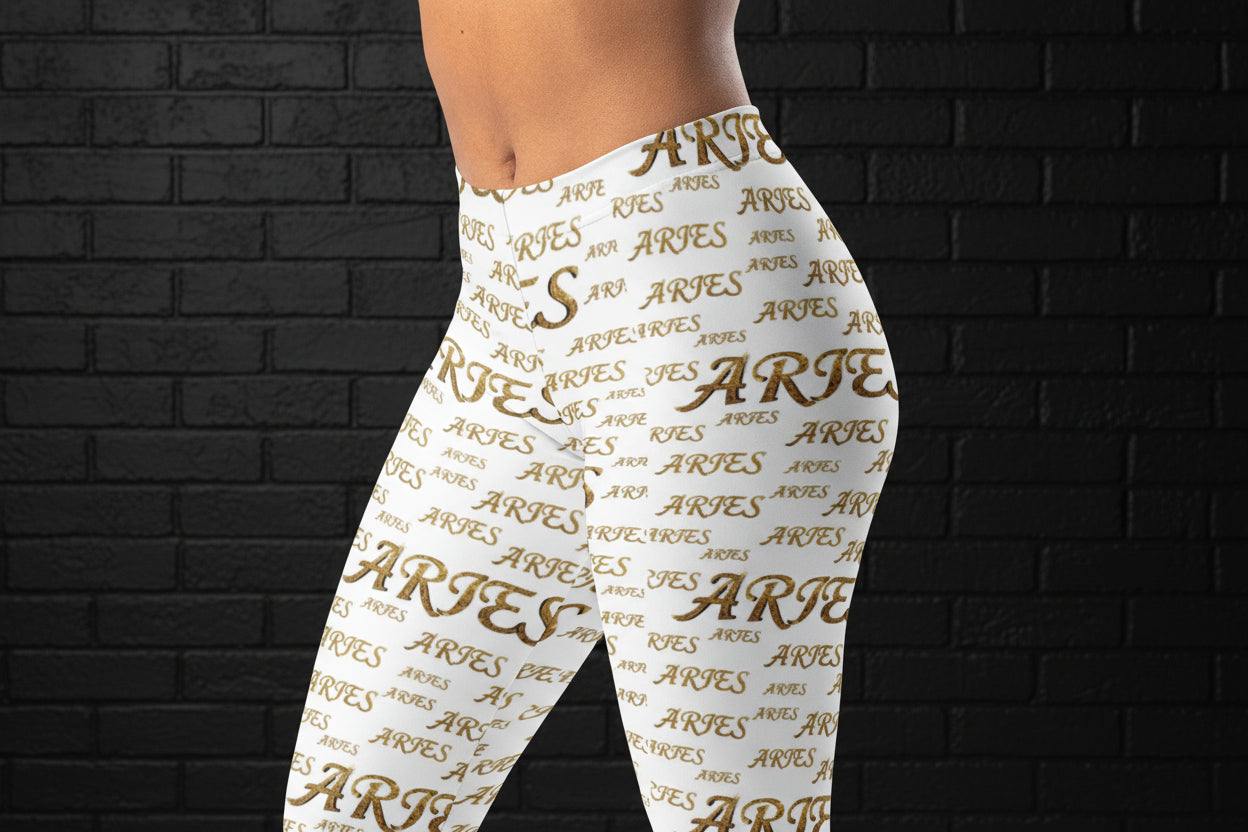 Side view of high waisted white yoga leggings with a golden Aries all-over print on a body-contouring fit.